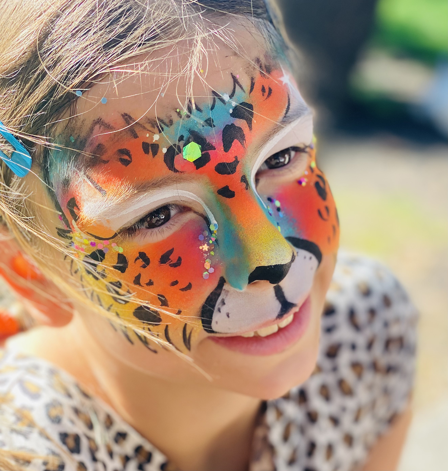 Rainbow cheetah face paint by Audette- Bedazzled Face Paint & Body Art in Santa Rosa & Wine Country, California 